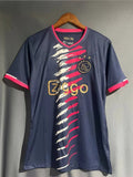Maillot de football Ajax 2024/25 de la marque Le 12, vue de face avec logo et design sportif visible.