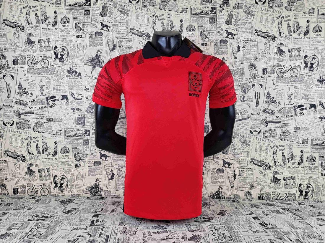 Maillot domicile de l'équipe de Corée du Sud 2022, fabriqué par Le 12, affichant les couleurs officielles et le logo national.