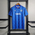 Maillot rétro Le 12 Naples 1991/93, maillot de football vintage, en tissu bleu avec logo et détails de l'époque.
