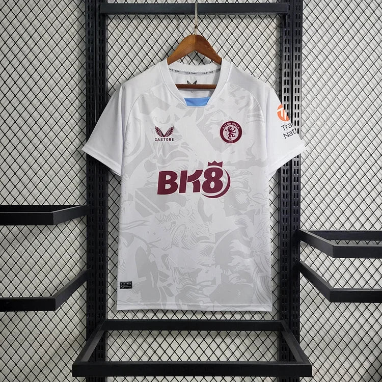 Maillot extérieur Aston Villa 2023/24 Le 12 -ème Maillot, vue de face avec logo et détails du design orange et bleu