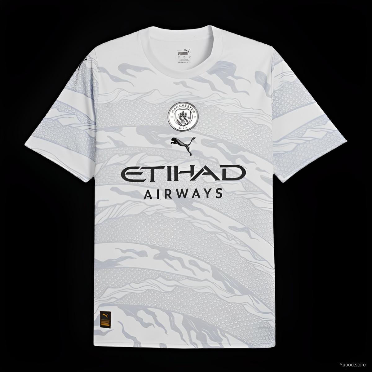 Maillot Manchester City 24/25 Dragon, marque Le 12 -ème Maillot, vue de face avec détails du design bleu et blanc.