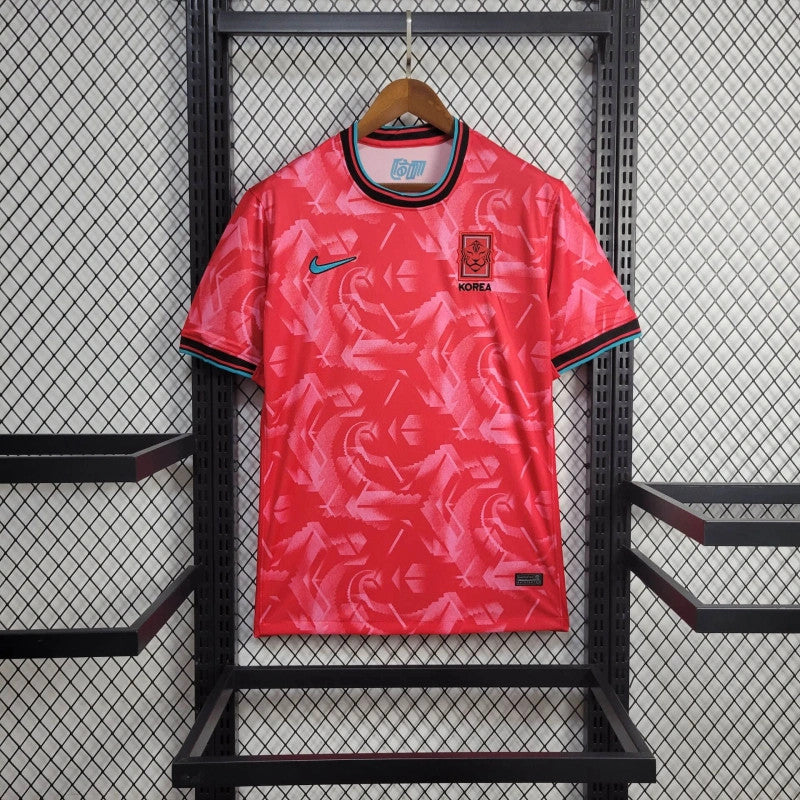 Maillot extérieur de l'équipe de Corée du Sud 24/25, marque Le 12, avec logo Nike, en tissu sportif bleu et blanc.