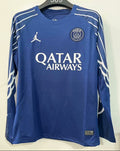 Maillot PSG bleu à manches longues Le 12-ème pour enfants 25/26, logo du PSG visible sur la poitrine.