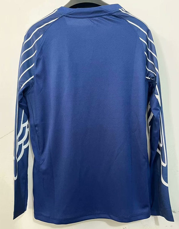 Maillot de football PSG bleu à manches longues Le 12-ème Maillot pour enfants 25/26, logo du club visible.