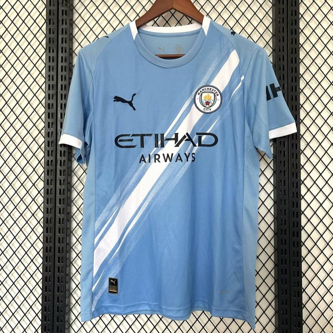 Maillot domicile Manchester City 25/26 de Le 12 -ème Maillot, maillot de football bleu avec logo et détails du club.