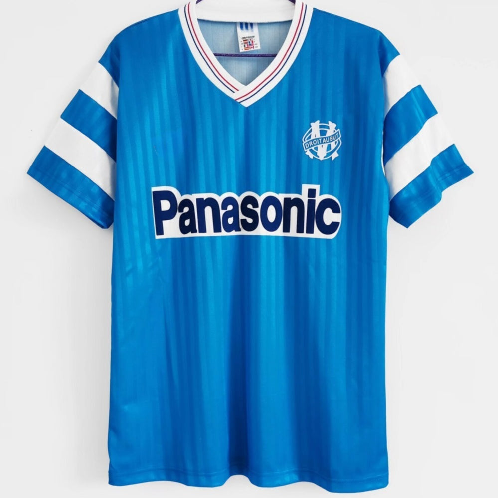 Maillot rétro extérieur 1990 Marseille Le 12 -ème Maillot, maillot de football vintage avec logo et détails colorés.