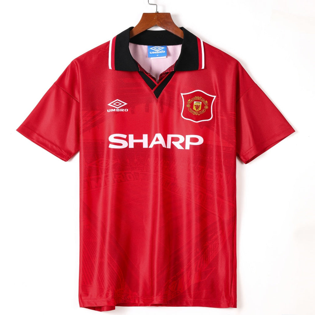 Maillot domicile Manchester United rétro 1994-1996, marque Le 12-ème Maillot, vue de face avec logo et détails traditionnels