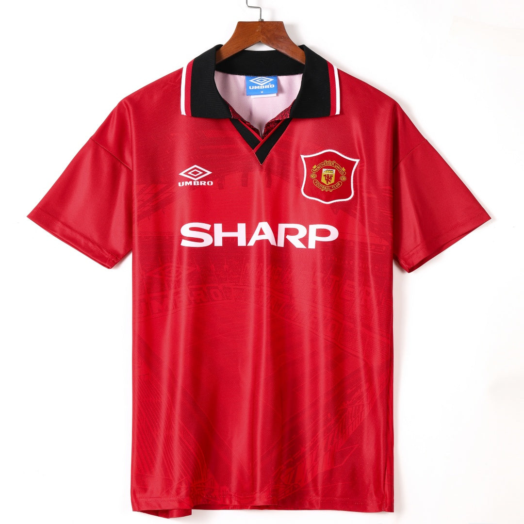 Maillot domicile Manchester United rétro 1994-1996, marque Le 12-ème Maillot, vue de face avec logo et détails traditionnels