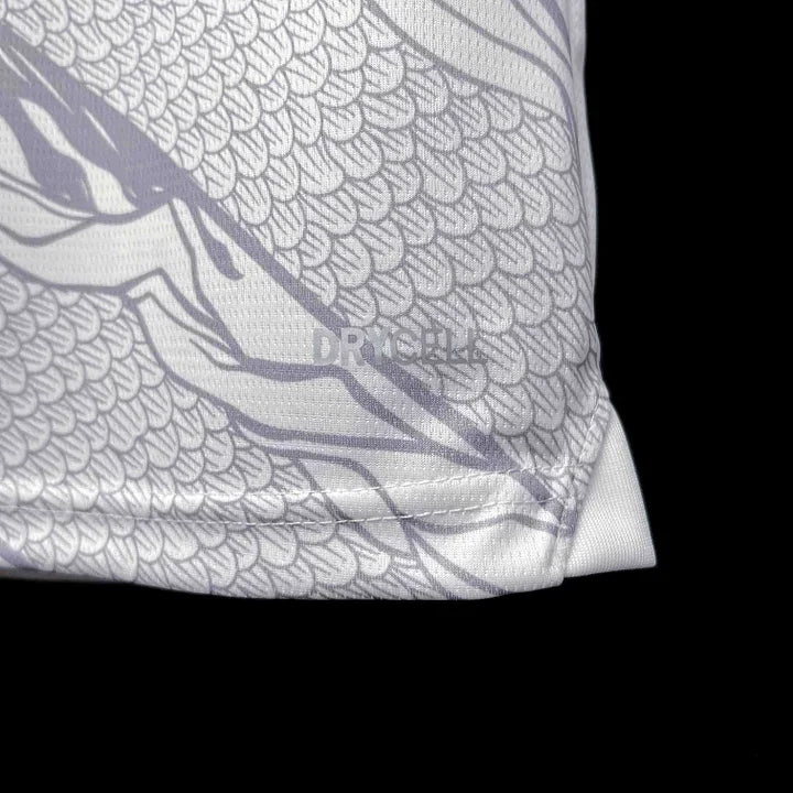Maillot Manchester City saison 2023-2024 Le 12, édition Nouvel An Chinois, maillot de football avec logos et design festif.