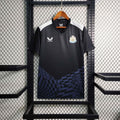 Maillot d'entraînement Newcastle 2023-24 Le 12 -ème Maillot, maillot de football avec logo et détails sportifs visibles.