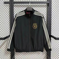 Veste coupe-vent réversible Le 12 -ème Maillot avec logo, en tissu léger, visible en couleur noire et orange.