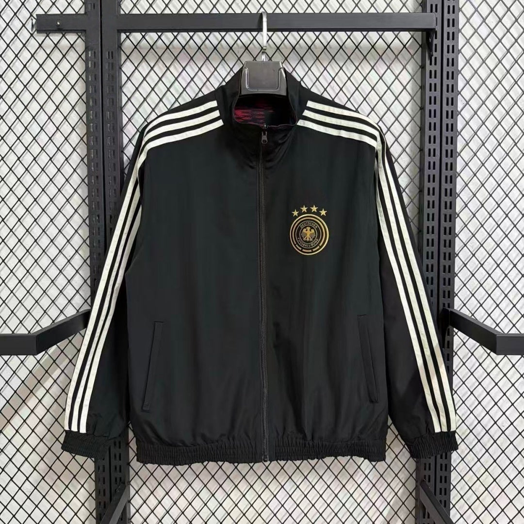 Veste coupe-vent réversible Le 12 -ème Maillot avec logo, en tissu léger, visible en couleur noire et orange.