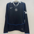 Maillot Chelsea Third Manches Longues Le 12 -ème Maillot, bleu avec logo du club, vue de face sur mannequin.