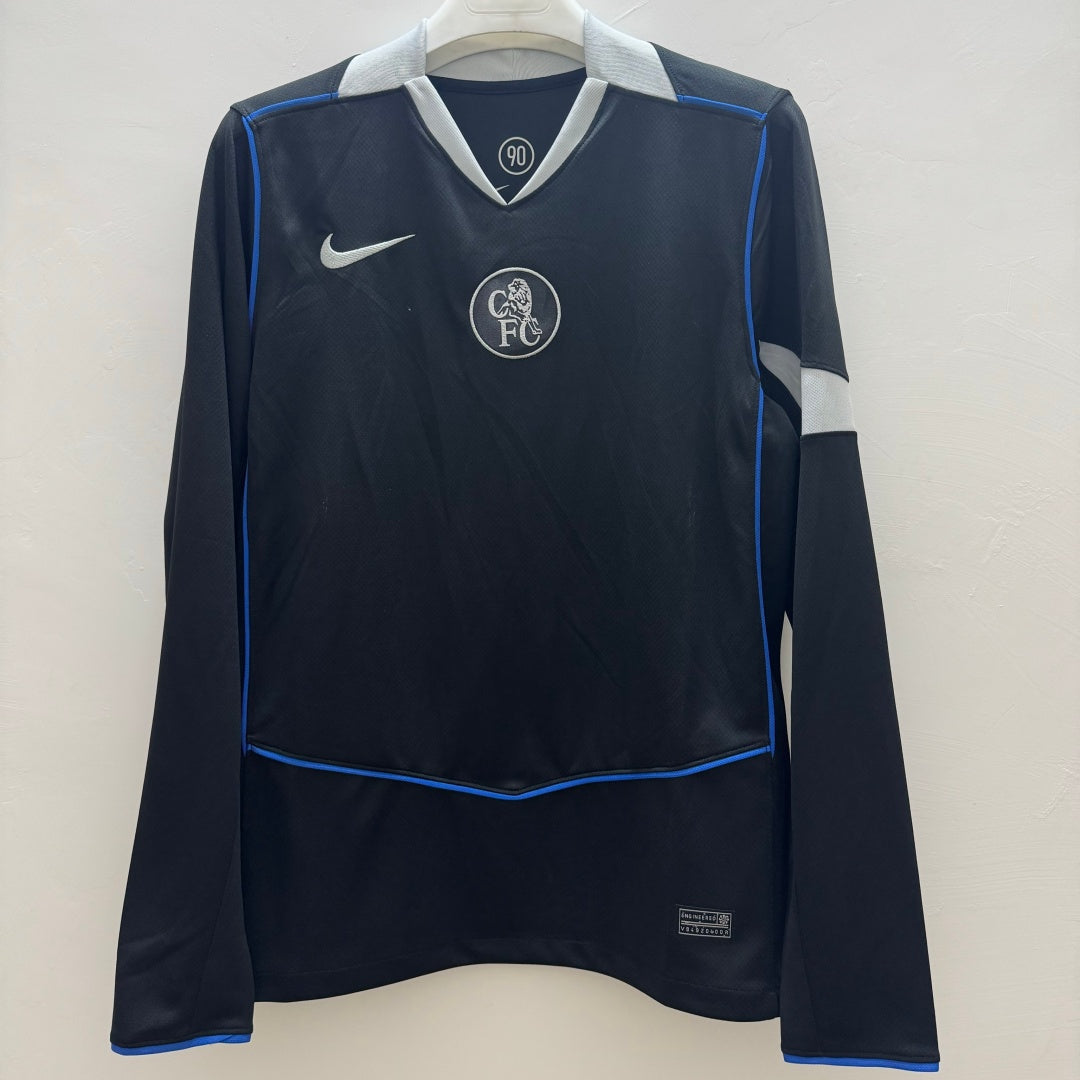 Maillot Chelsea Third Manches Longues Le 12 -ème Maillot, bleu avec logo du club, vue de face sur mannequin.