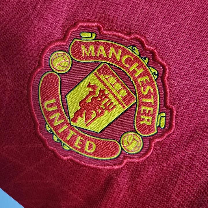 Maillot domicile Manchester United 2023 2024 Le 12 -ème Maillot, maillot de football rouge avec logo et détails du club.