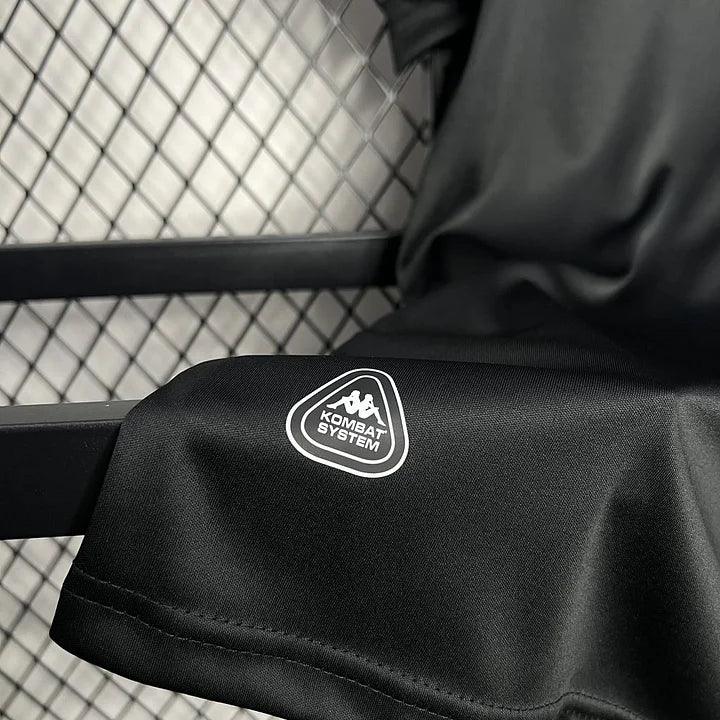 Maillot de football noir AS Monaco 2024-2025, marque Le 12 -ème Maillot, vue du devant avec logo du club.