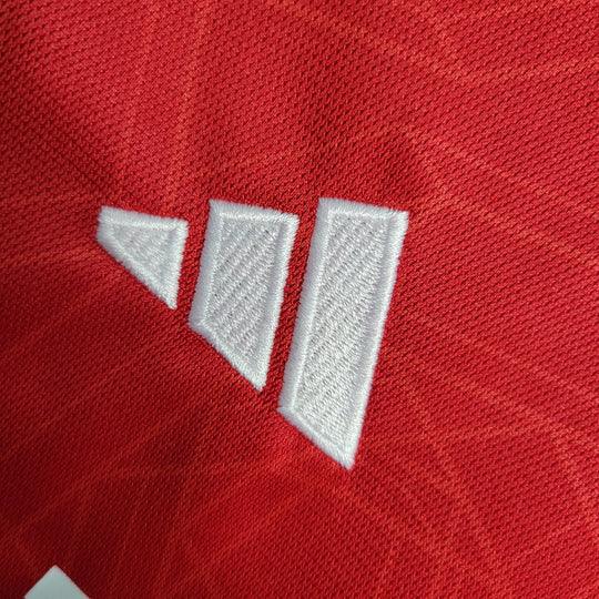 Maillot Manchester United 2023 2024 à manches longues, de la marque Le 12 -ème Maillot, avec logo et design officiel.