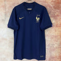 Maillot domicile de l'équipe de France 2022 Le 12-ème Maillot, maillot de football bleu avec logo national et détails de l'équipe.