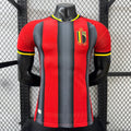 Maillot extérieur Belgique 25/26 de Le 12 -ème Maillot, vue de face avec logo officiel, couleurs noir, jaune et rouge.