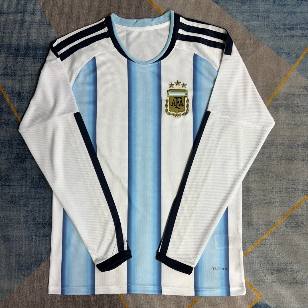 Maillot domicile Argentine 25/26 à manches longues, marque Le 12 -ème Maillot, vue de face avec logo et détails bleus et blancs.