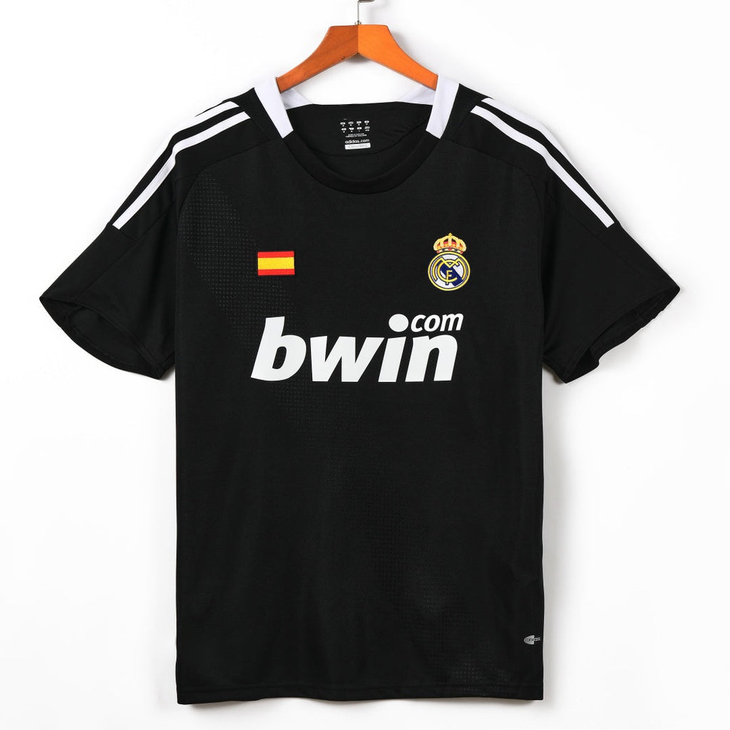 Maillot extérieur rétro du Real Madrid 2009-2010 de la marque Le 12 -ème Maillot, vue de face avec logo et détails du design.