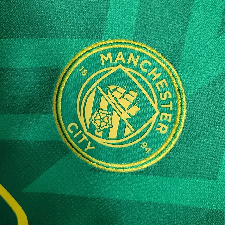 Maillot de gardien Manchester City 2023-2024 Le 12-ème Maillot, maillot de football avec logo et détails en bleu et blanc.