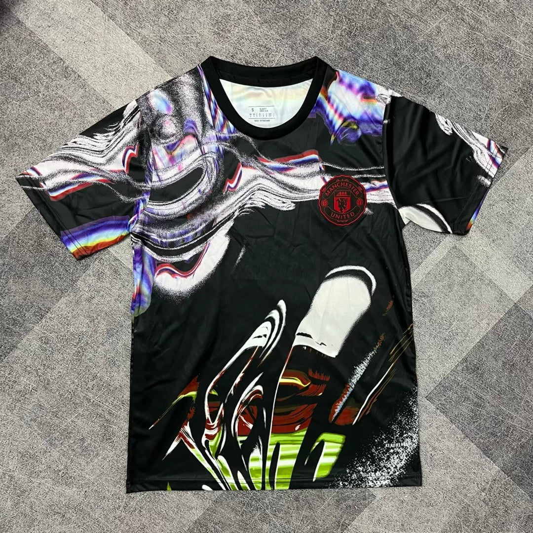 Maillot Manchester United Le 12 -ème Maillot, noir, taille 25/26, vue de face avec détails du logo et design sportif.