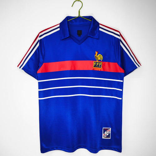 Maillot rétro de football France domicile 1984 de la marque Le 12 -ème Maillot, vue front avec logo et détails traditionnels