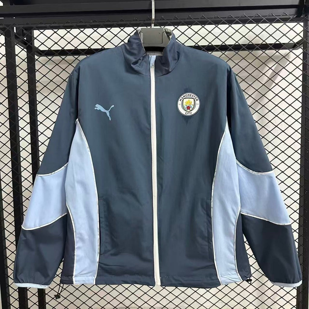 Veste coupe-vent réversible Manchester City Le 12 -ème Maillot, tissu léger avec logo de l'équipe et design coloré.