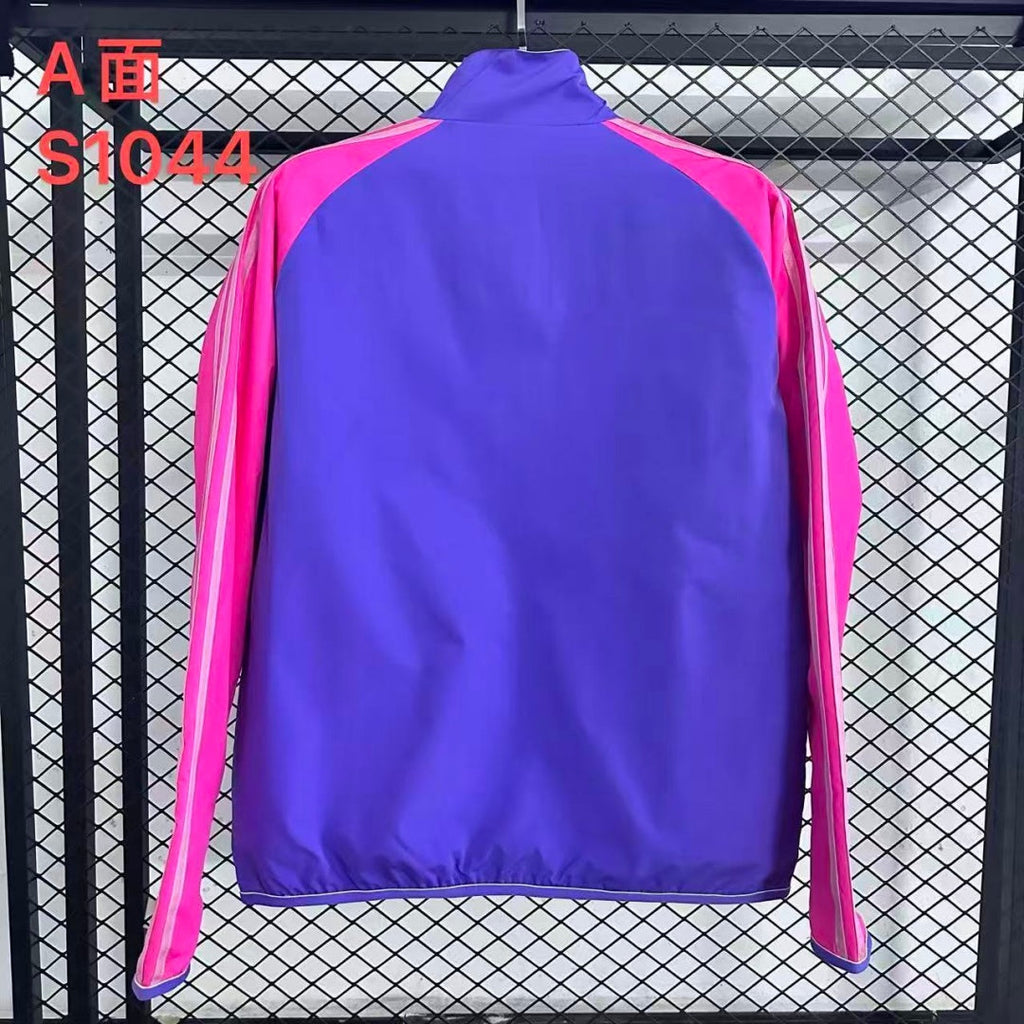 Veste coupe-vent réversible Le 12 -ème Maillot Allemagne, tissu léger, design coloré, vue de face avec fermeture éclair visible.