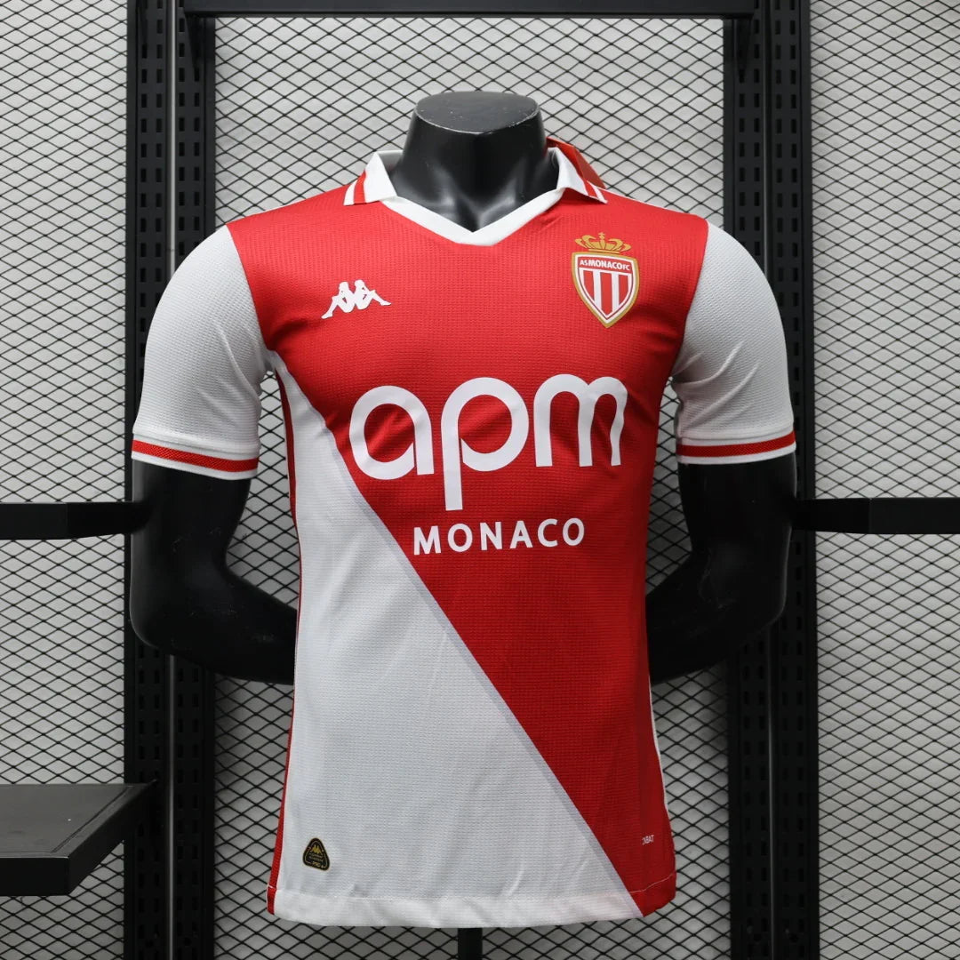 Maillot Monaco 2024-25 de Le 12 -ème Maillot, devant avec logo et détails bleus et rouges sur tissu léger.