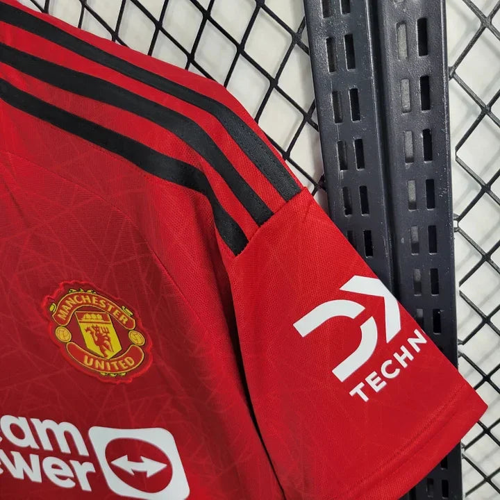 Maillot domicile Manchester United 2023 2024 de Le 12 -ème Maillot, vue de face avec logo et design rouge.