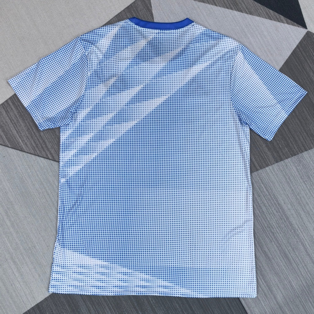 Maillot de football 25/26 USA Le 12 -ème Maillot, jersey sportif avec logo et détails bleu, blanc et rouge, vue de face.