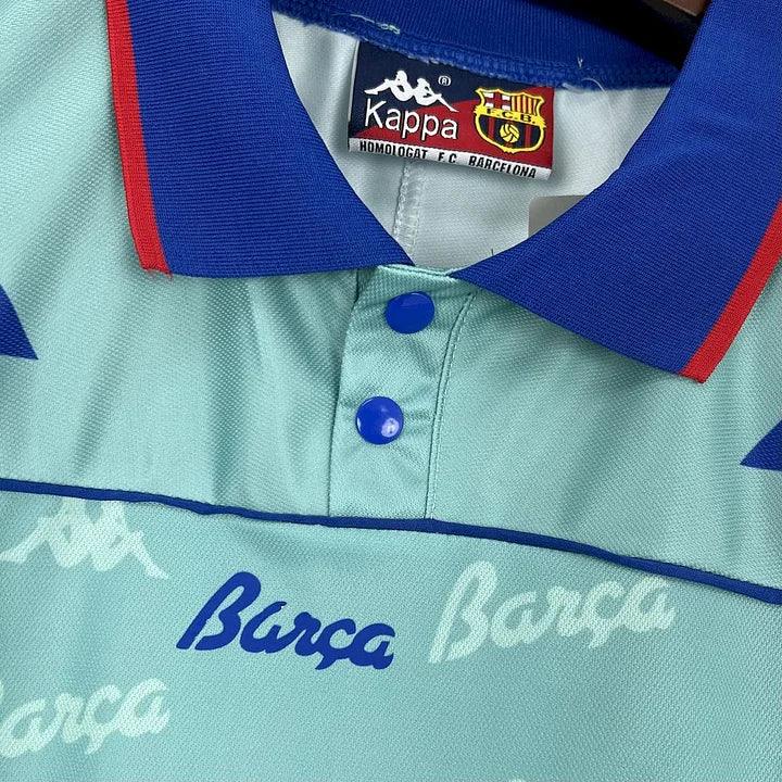 Maillot de football rétro FC Barcelone 1992-1995, marque Le 12 -ème Maillot, avec les couleurs et le logo emblématique du club.
