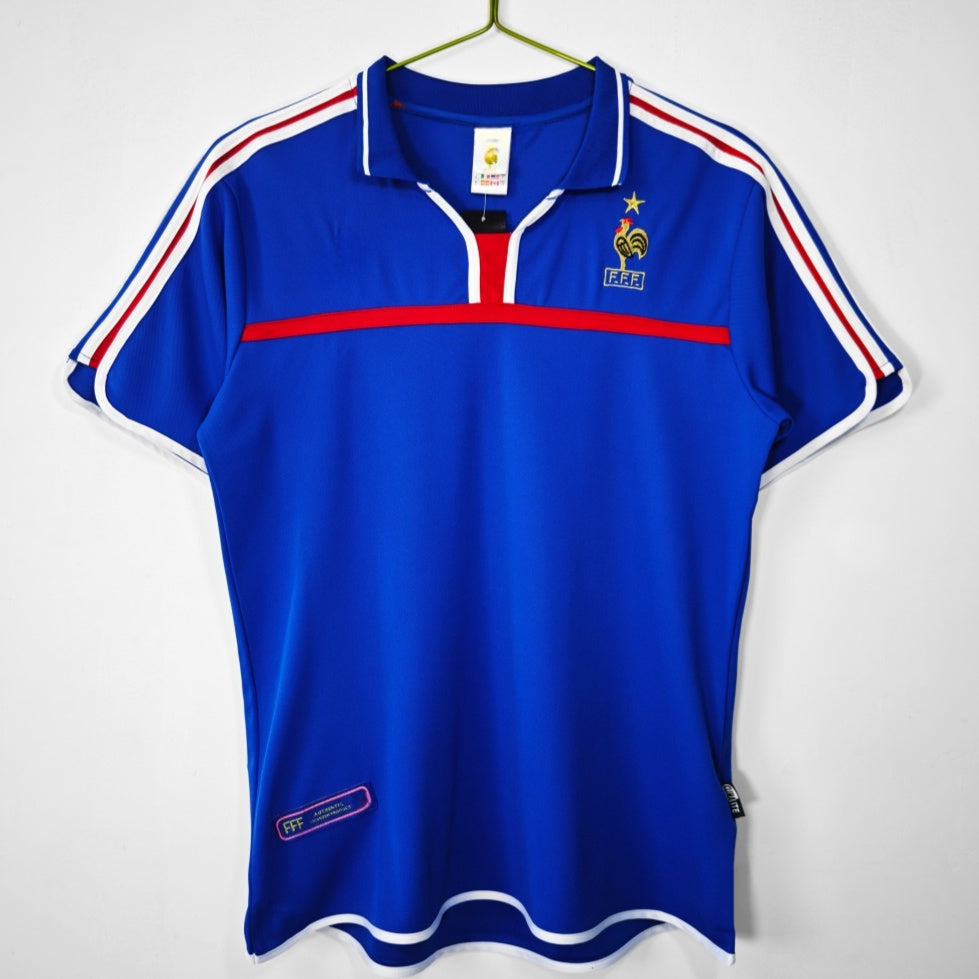 Maillot rétro domicile France 2000 de la marque Le 12 -ème Maillot, vue de face avec détails du design.