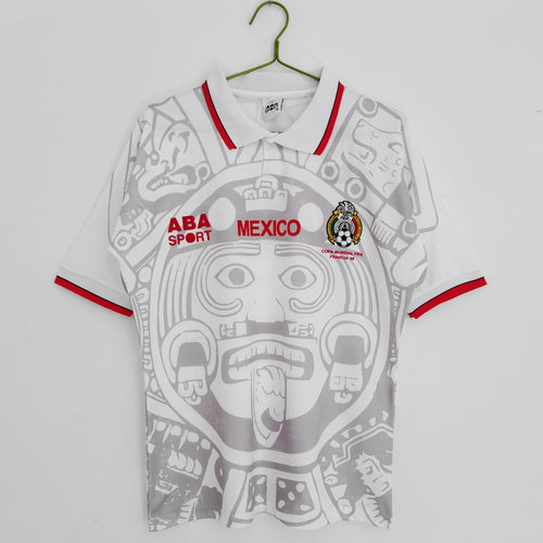 Maillot extérieur rétro 1998 Mexique, de la marque Le 12, affichant les couleurs et le design emblématique du maillot de football.