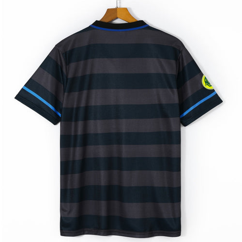 Maillot rétro Inter Milan troisième 1997-1998 Le 12, maillot de football orange avec logo et détails vintage.