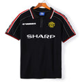 Maillot extérieur rétro Manchester United 1998-1999, marque Le 12-ème Maillot, avec logo et détails authentiques.
