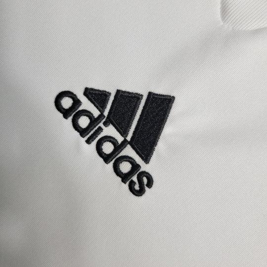 Maillot rétro de Milan AC 2009-2010 de la marque Le 12, avec le logo du club et des détails du design sur le tissu.