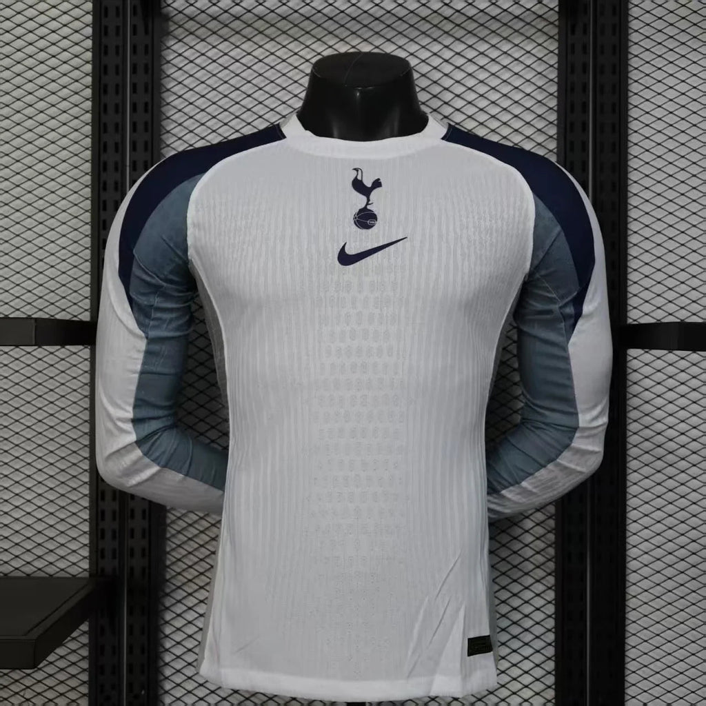 Maillot Tottenham à manches longues 2025-26, marque Le 12 -ème, tissu rouge avec logo et détails blancs, vue frontale.
