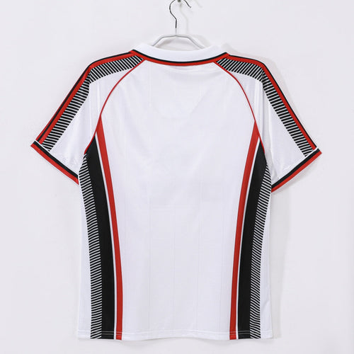 Maillot extérieur rétro 1997-1998 de l'AC Milan, marque Le 12ème, avec design classique et couleurs emblématiques.