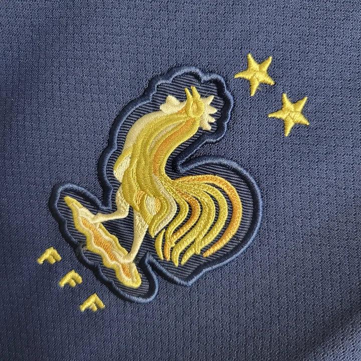 Maillot domicile de l'équipe de France 2022/23, marque Le 12 -ème Maillot, avec les couleurs traditionnelles et le logo national.