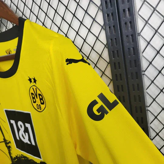 Maillot Dortmund 2023 2024 à manches longues, marque Le 12 -ème Maillot, vue de face avec logo et design noir et jaune.