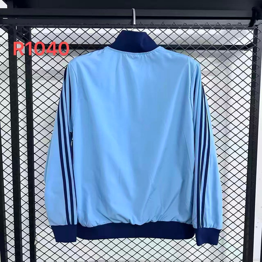 Veste coupe-vent réversible Le 12 -ème Maillot Argentine R1040, montrant les deux côtés en tissu léger et coloré.
