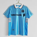 Maillot extérieur rétro de 1998-1999 de Marseille, marque Le 12ème Maillot, avec design vintage et couleurs authentiques.