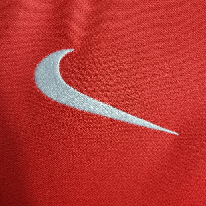 Maillot d'entraînement Le 12 Paris 2023 2024, maillot de sport avec logo et détails de design visibles sur l'image.