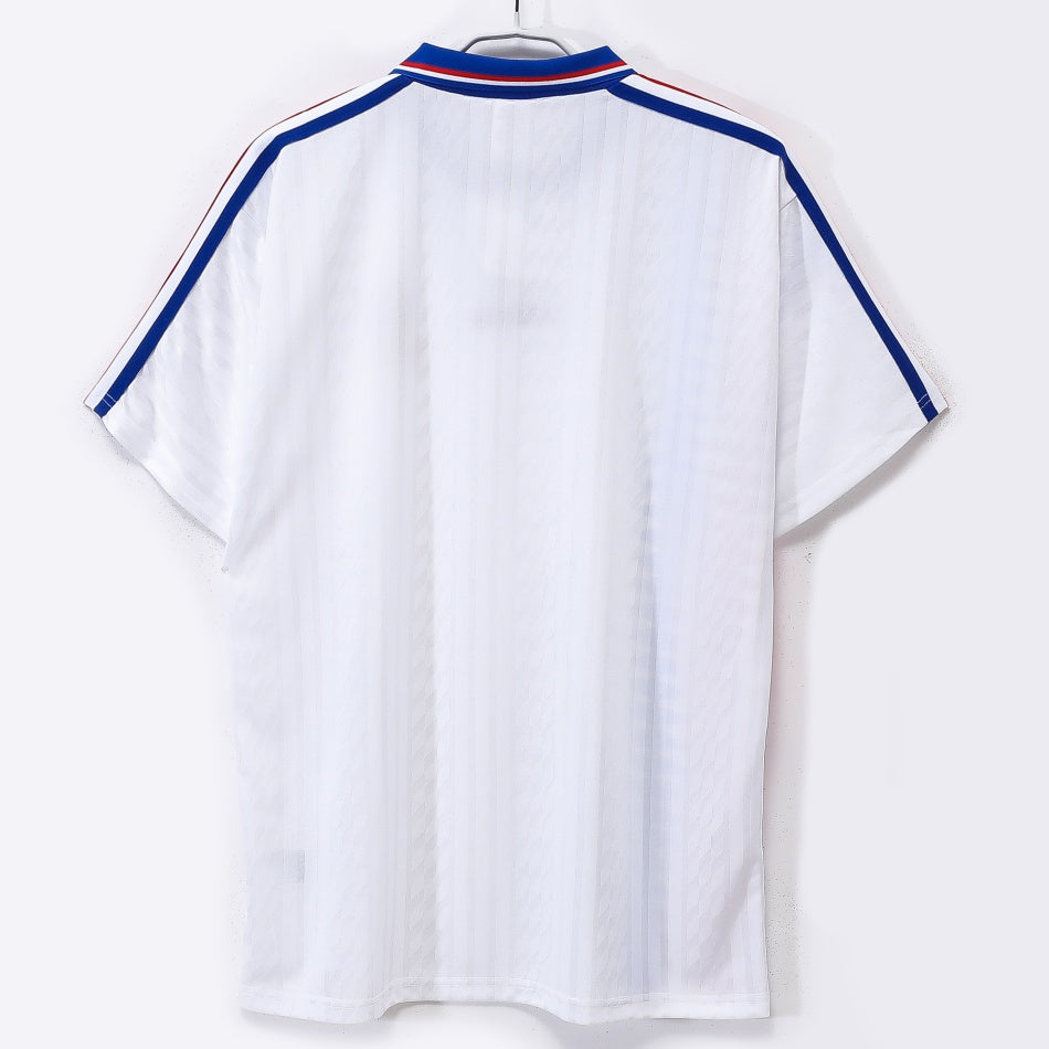Maillot rétro de football France 1994, maillot extérieur en polyester avec logo Le 12 -ème Maillot, vue de face.
