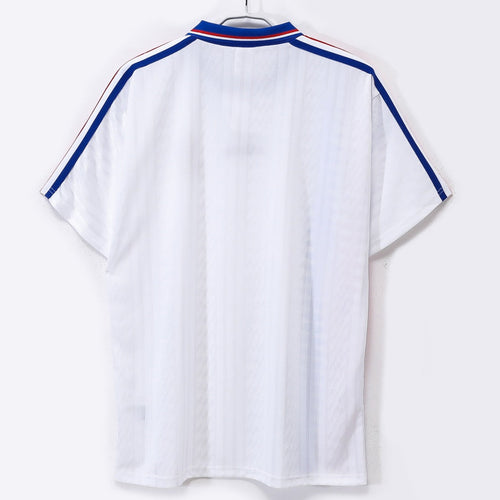 Maillot rétro de football France 1994, maillot extérieur en polyester avec logo Le 12 -ème Maillot, vue de face.