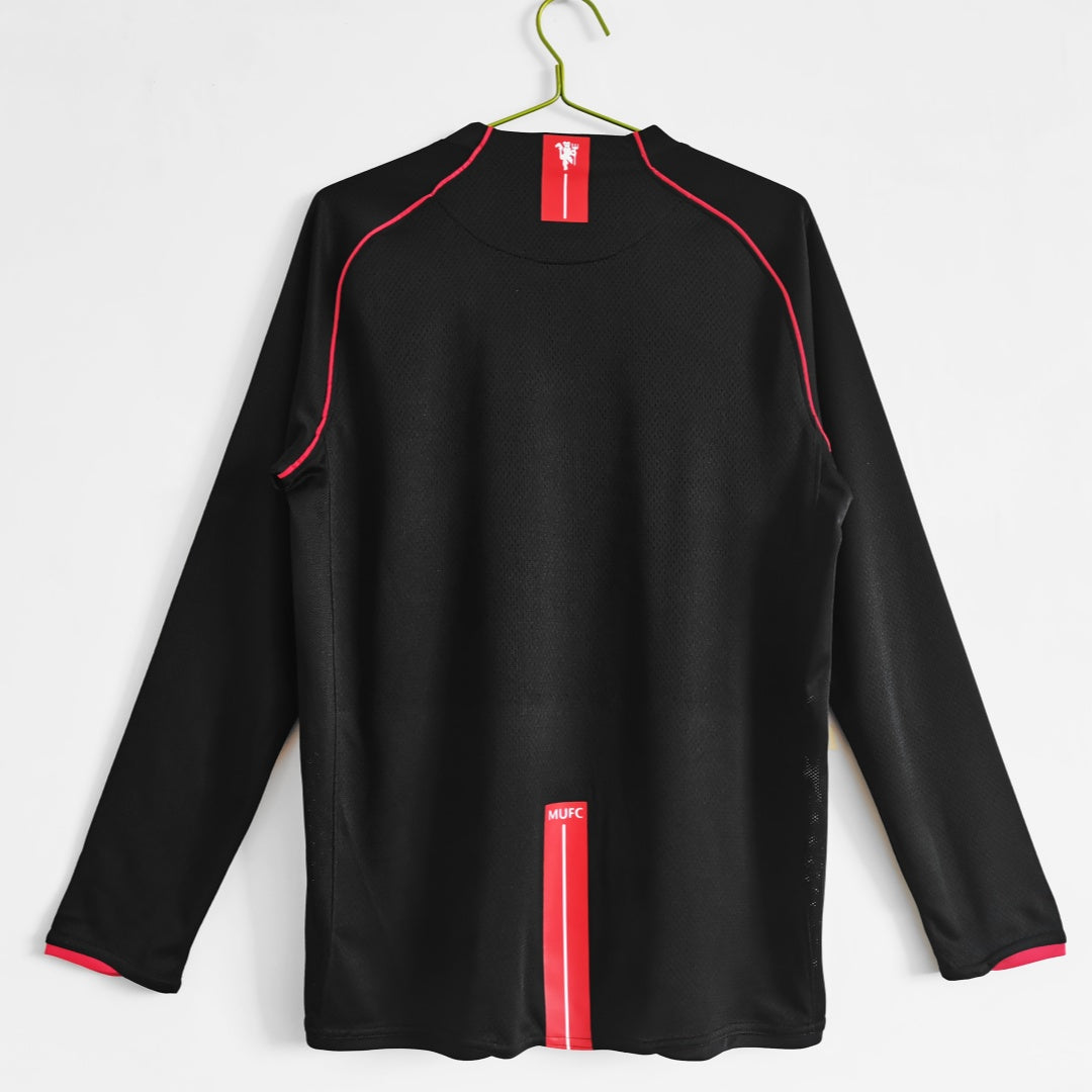Maillot extérieur rétro Manchester United Manches longues 2007-2008, marque Le 12-ème Maillot, vue de face avec logo et détails blancs
