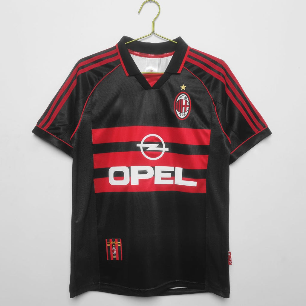 Maillot rétro de football AC Milan 1998-1999, maillot third de la marque Le 12-ème Maillot, vue de face avec logo et détails.